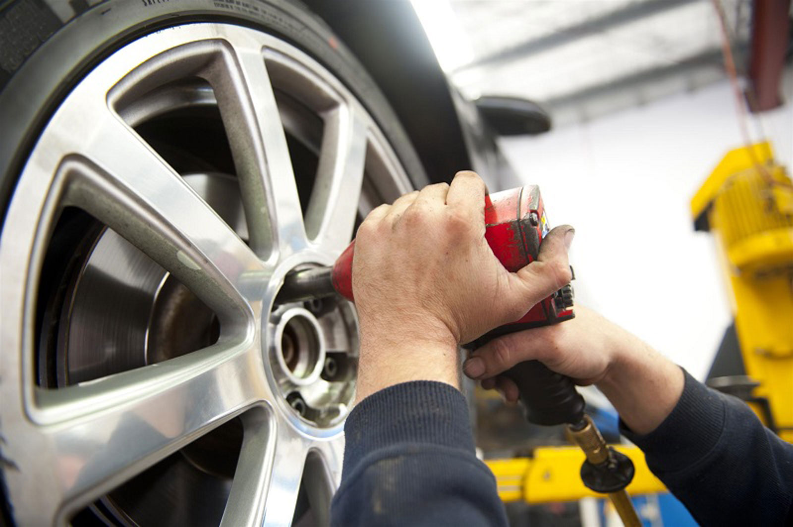 7 Hard Truths about Soft Skills Picture: Close up of mechanic hand fixing car tire.